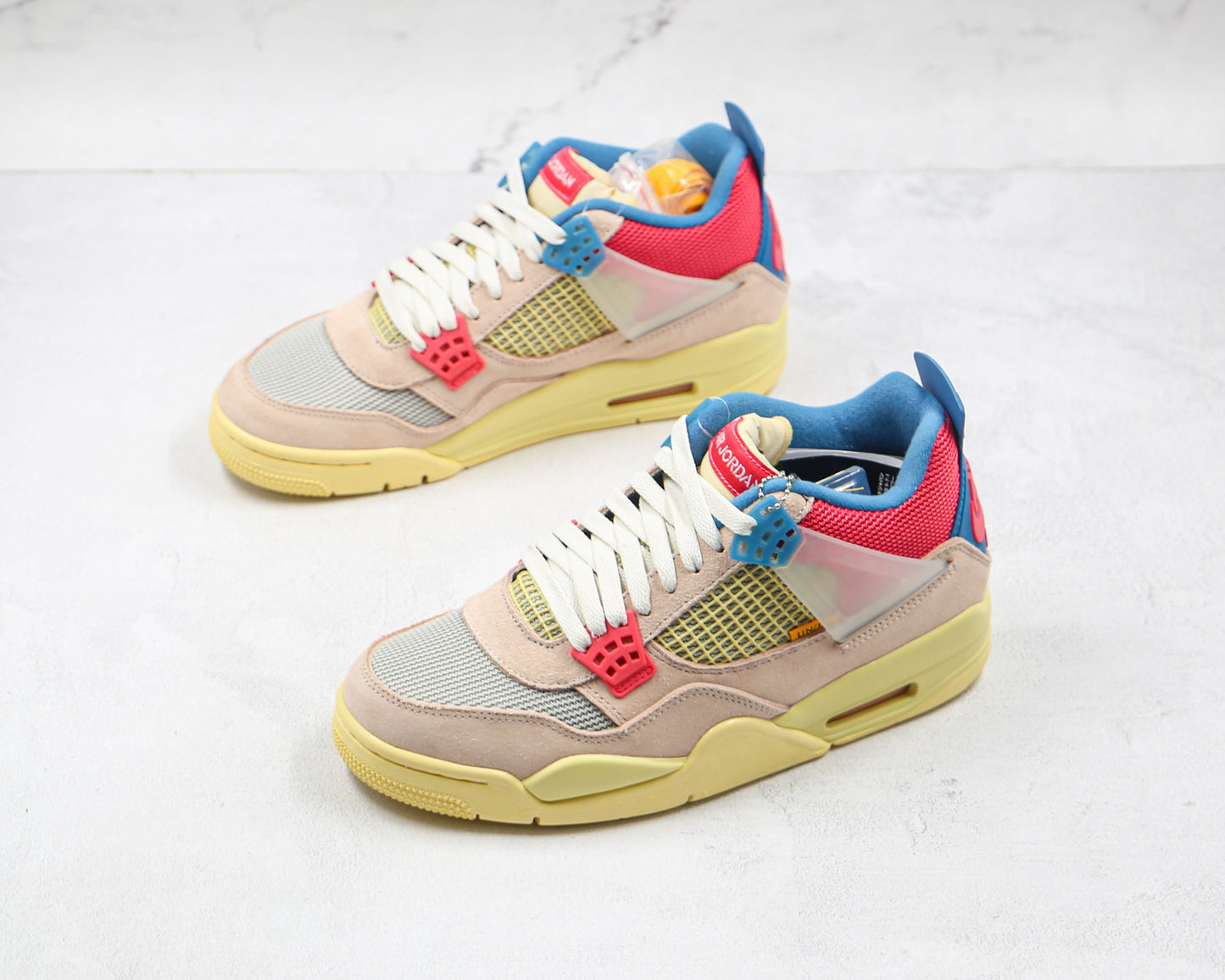 Jordan 4 Retro Union Guava Ice 